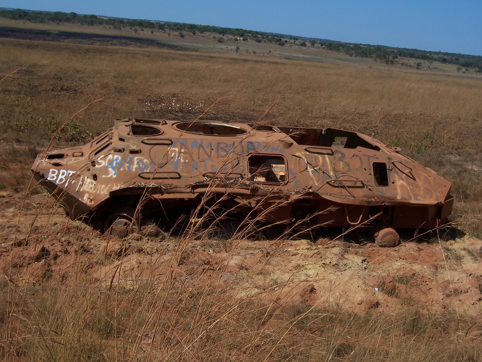 Landmines and destroyed military equipment litter the Angolan countryside